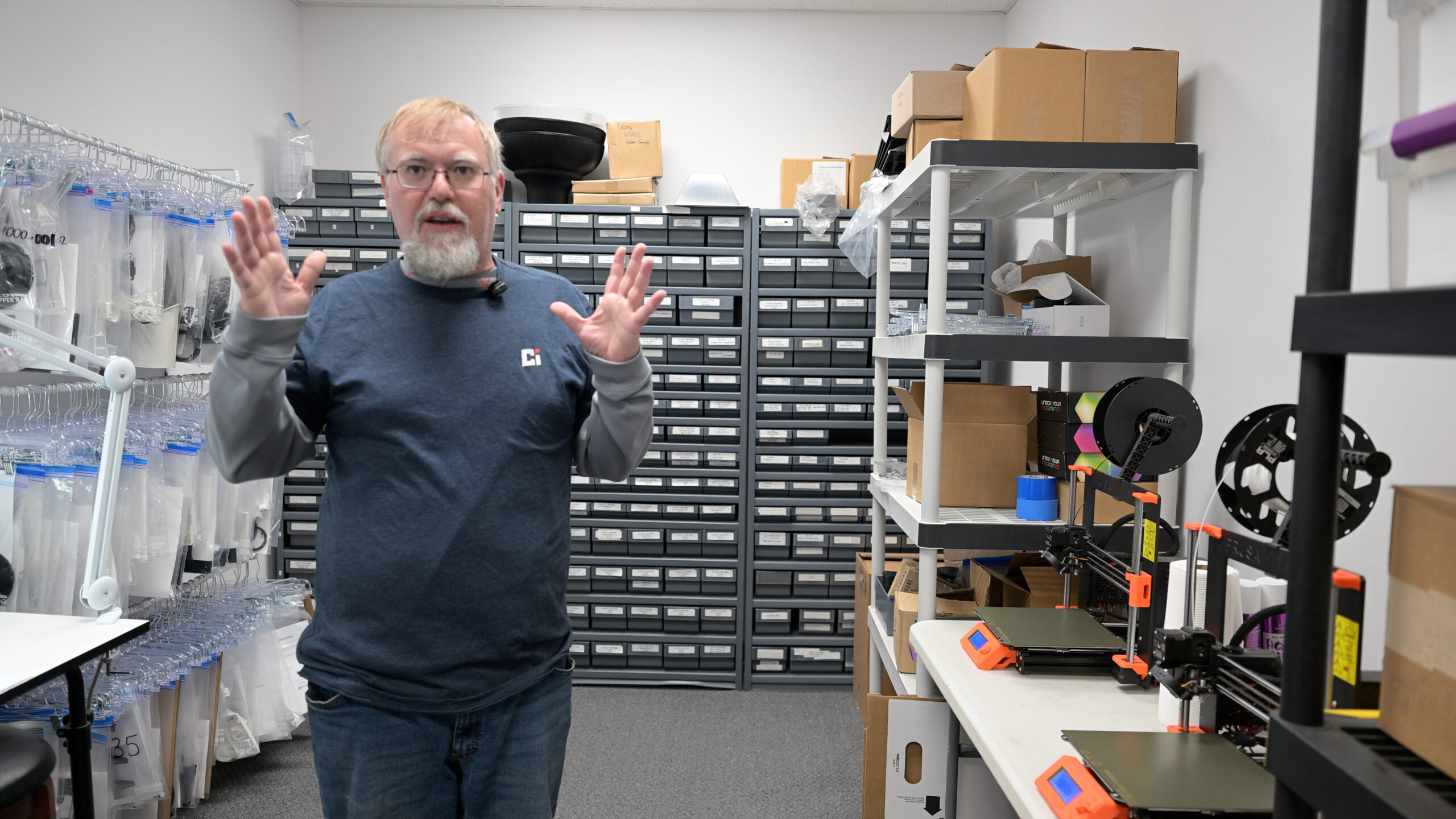 Dave standing next to 3D printers on the Crestwood Industries shop floor